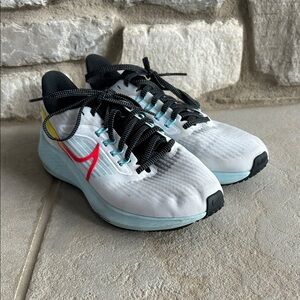 Nike White and Black Athletic Shoes with Red and Blue Accents